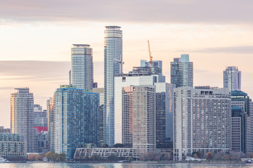 Fototapeta na wymiar High-rise buildings and skyscrapers line the waterfront of Toronto Harbour