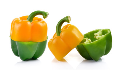 colored peppers over white background