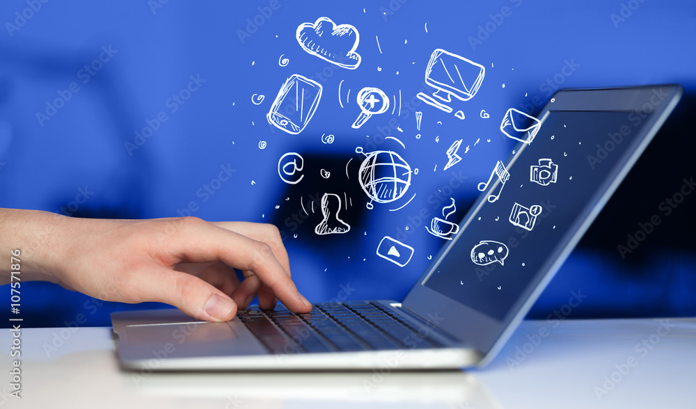 Aufkleber Hand writing on notebook computer with media icons