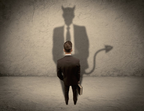 Salesman facing his own devil shadow