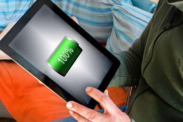Man holding pad with full batery charge