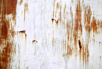 Rusted scratch grey painted on metal wall background. Grunge texture surface metal sheet. Vintage and retro backdrop. Close up.