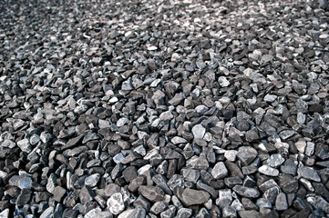 Pattern grey gravel granite texture background for mix rock concrete pattern in construction industrial. Small gray pebble on ground or floor. Macro and blur. Close up.