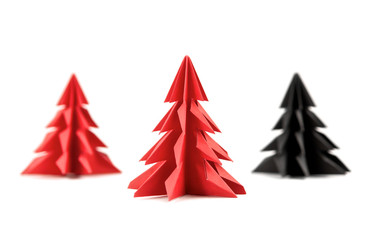 Origami Christmas tree paper isolated on white background. For decoration, Merry Christmas postcard vintage with red paper. Happy New Year. Front view. Close up.