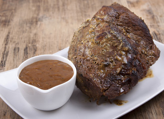 Roast beef with   onion sauce.