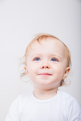 Fototapeta premium Little girl a on white background. Portrait