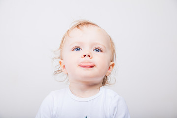 Naklejka premium Little girl a on white background. Portrait