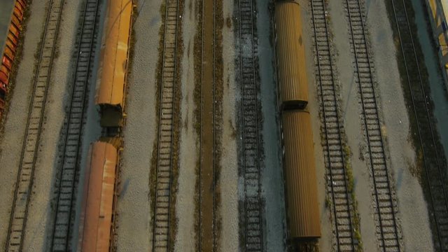 Close aerial plan view at rail freight container terminal. Shoot taken late afternoon on summer time.
