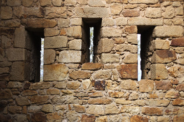 Three window holes on a medieval rock fortress