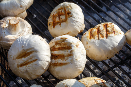 Grilled Paris mushroom on the grid