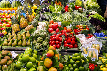 La Boqueria market with vegetables and fruits in Barcelona. Spain. La  Boqueria market, Europe's largest and most famous food markets