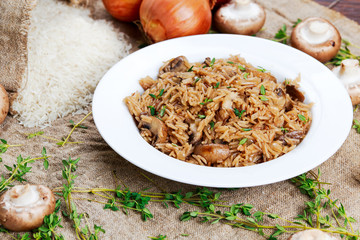 Risotto mushrooms with parmesan cheese, fresh herbs, rice, onion.