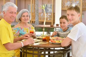Grandparents with grandchildren at breakfast