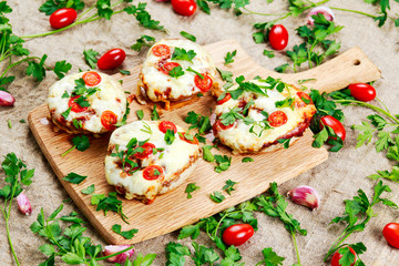 Cooked Mushrooms stuffed with cheese and plum tomatoes