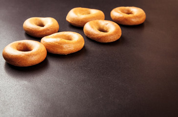 Ring bagels on a black background