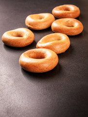 Ring bagels on a black background