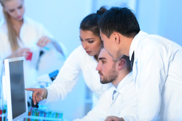 Fototapeta premium Young medical technicians working in laboratory