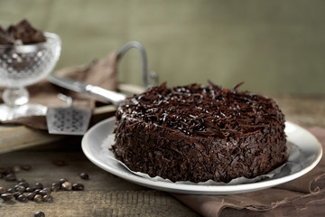 Tasty chocolate cake on wooden background