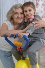 little granddaughter doing exercise