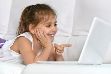 Cute little girl with   laptop