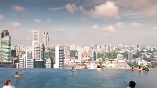 sunny day marina bay sands famous roof top swimming pool panorama 4k time lapse singapore
