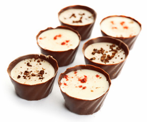 Assorted chocolate candies, isolated on white