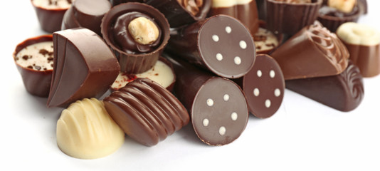 Assorted chocolate candies, isolated on white