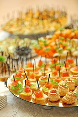 Dish with assorted snacks on a table
