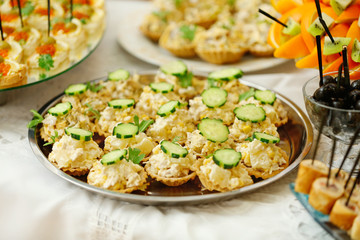 Dish with assorted snacks on a table