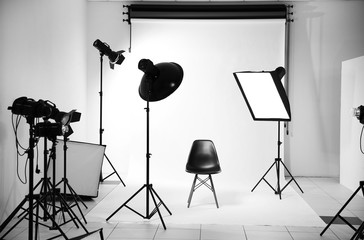 Empty photo studio with lighting equipment