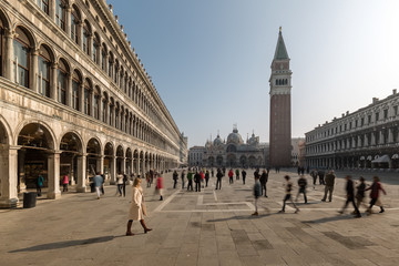 Fototapeta na wymiar People walking through St Mark's Square in Venice