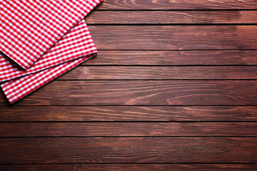 Checkered napkin on wooden background