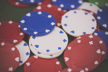 Poker chips and cards on a green table