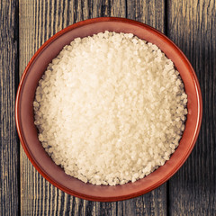 Sea salt on old wooden table