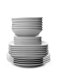 Stack of different ceramic plates, isolated on white