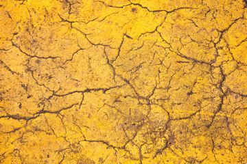 background of yellow textured surfaces with cracks