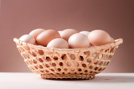 rustic basket with eggs on the table