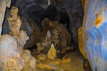 Colored stalactites and stalagmites in the cave