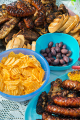 View of Grilled Meal - Appetizing Barbequed Meats and Vegetables