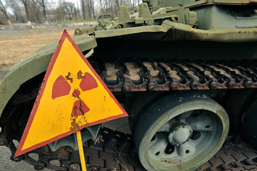 danger sign radiation on the background of the abandoned militar