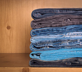 Jeans on a wooden shelf