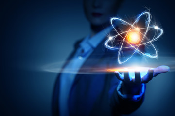 Atom molecule in female hand