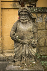 Traditional guard statue carved in stone on Bali island, Indonesia.