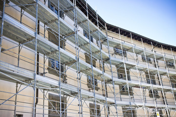 Metal scaffolding for the restoration of a building in a italian construction site