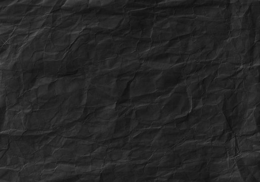 Fototapeta Black crumpled paper texture. Background and wallpaper