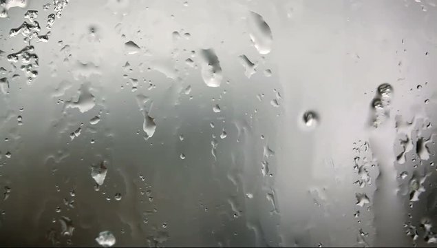 Look at the window with rain drops on the glass