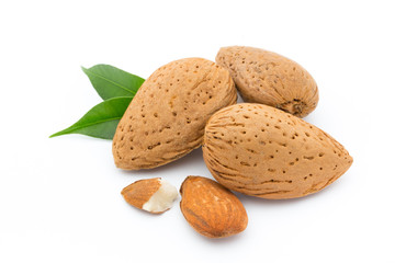 Almonds with leaves isolated on white background