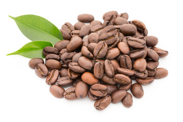 Coffee grains and leaves isolated on the white backgrounds.