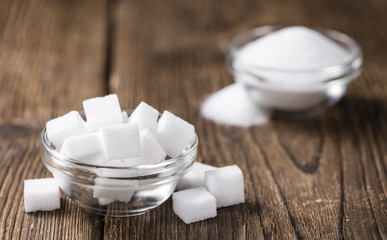 Old wooden table with white Sugar