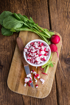 Diced Radishes on wooden background